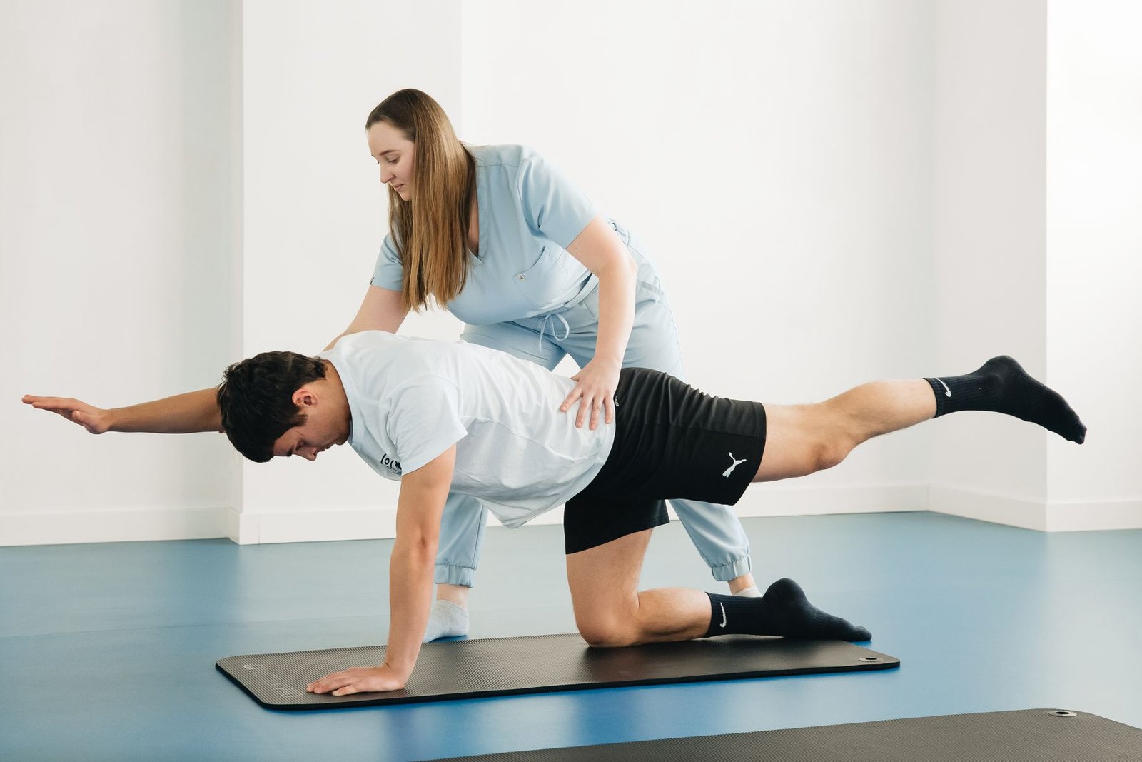 Physiotherapist guiding rehab exercises during broken ankle recovery time