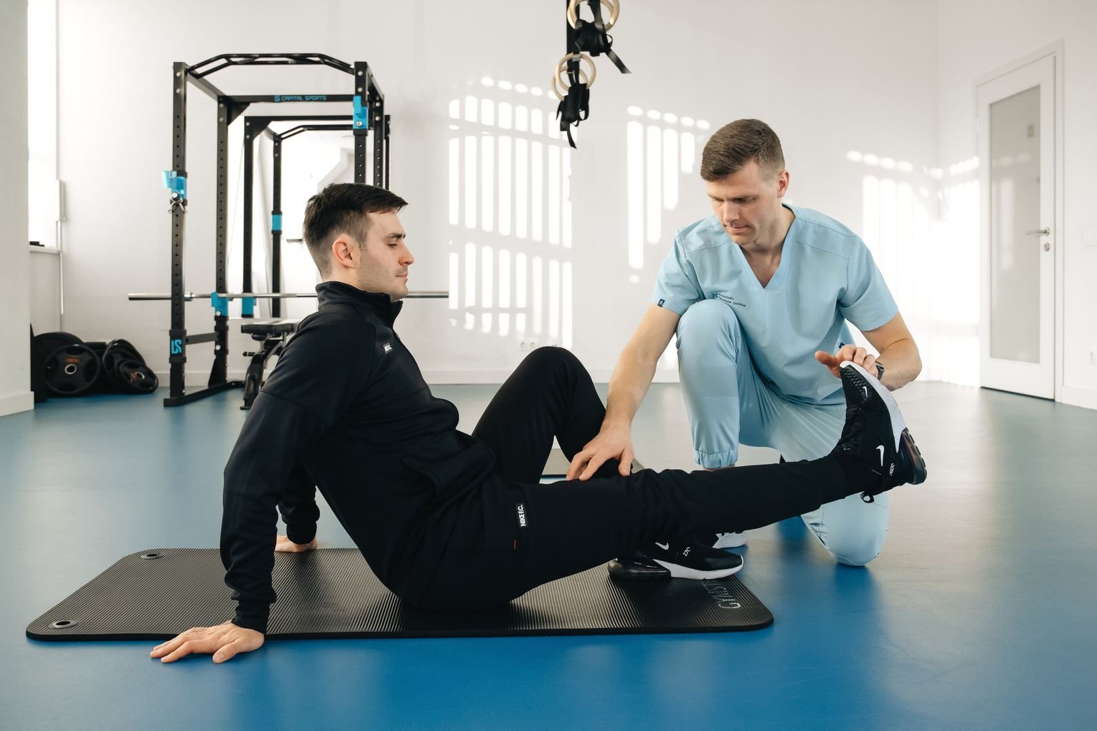 Therapist guiding a patient through an individualised prehab strength plan