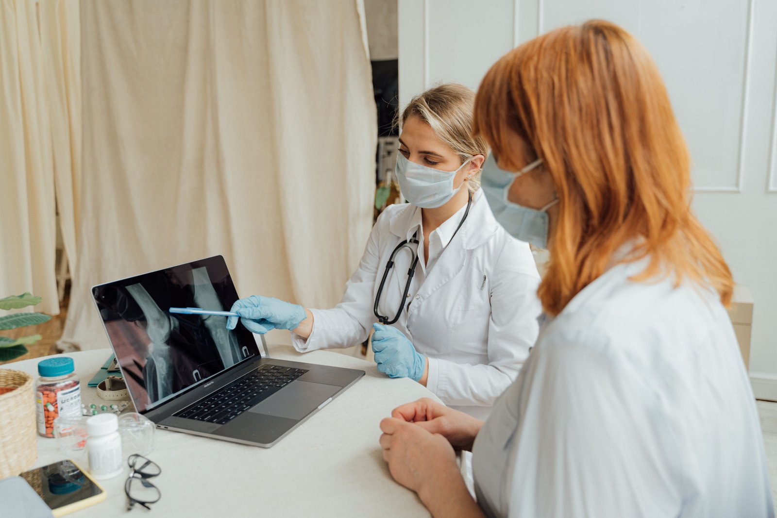 Clinician examining hip and groin during assessment for groin muscle pain