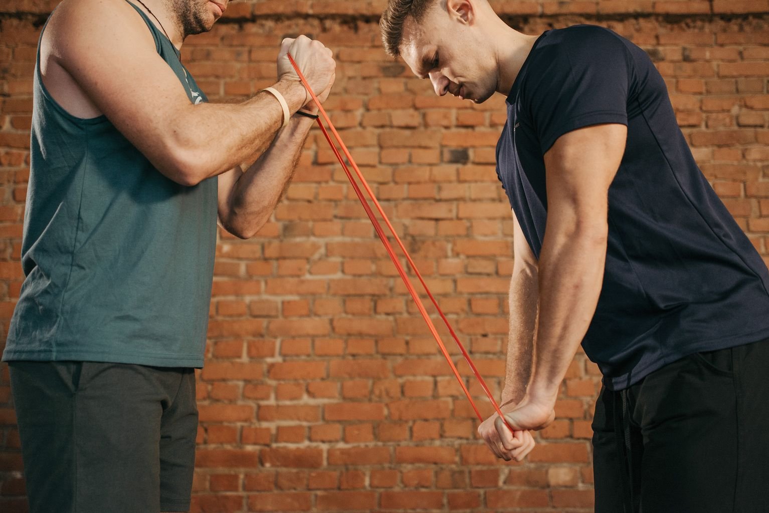 Resistance band pulling exercise targeting rhomboid major pain recovery