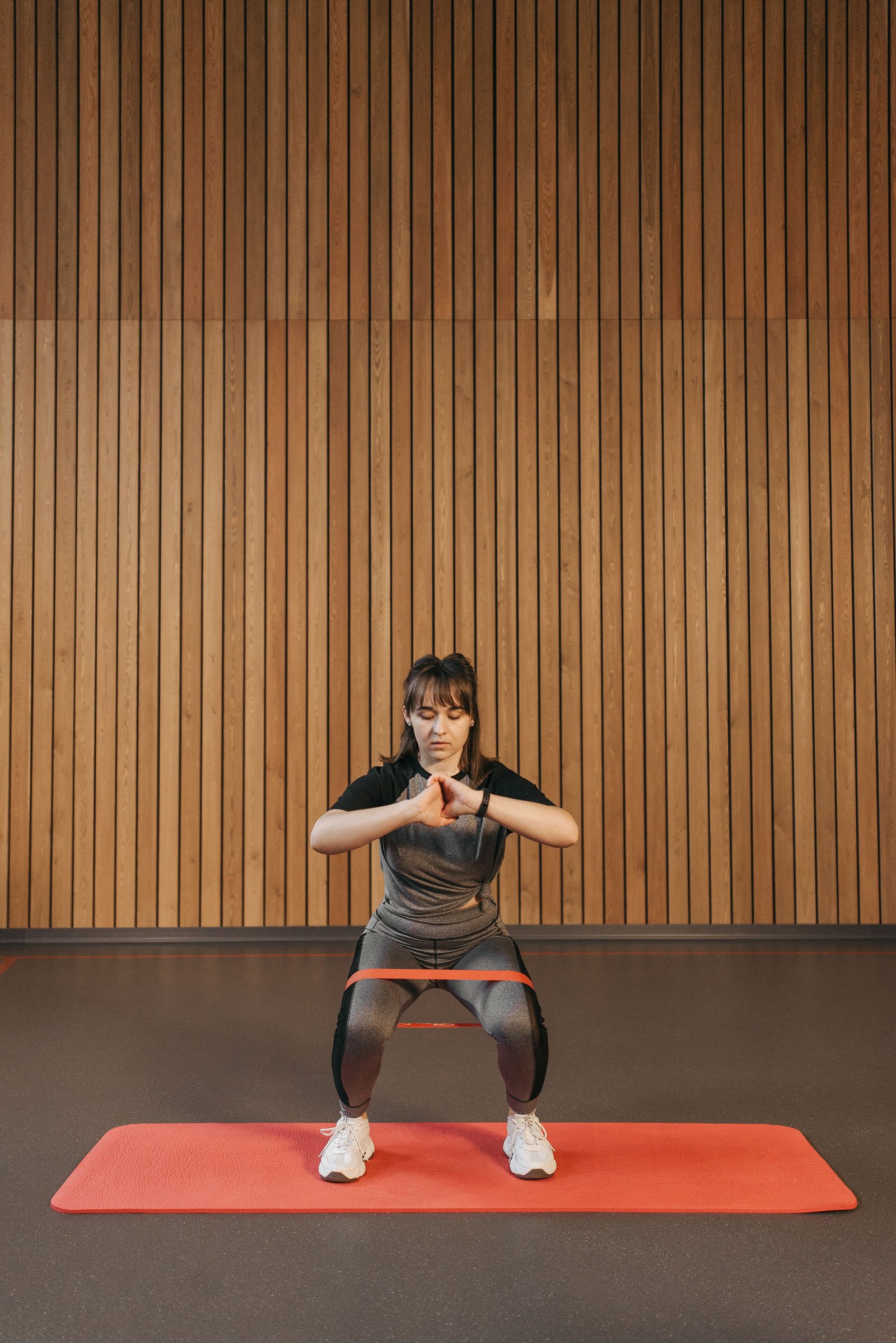Athlete performing a resistance band exercise during torn ligament rehabilitation