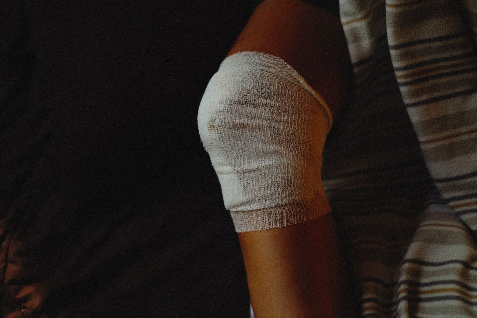 Bandaged knee during early injury care, relevant to mcl tear treatment approaches