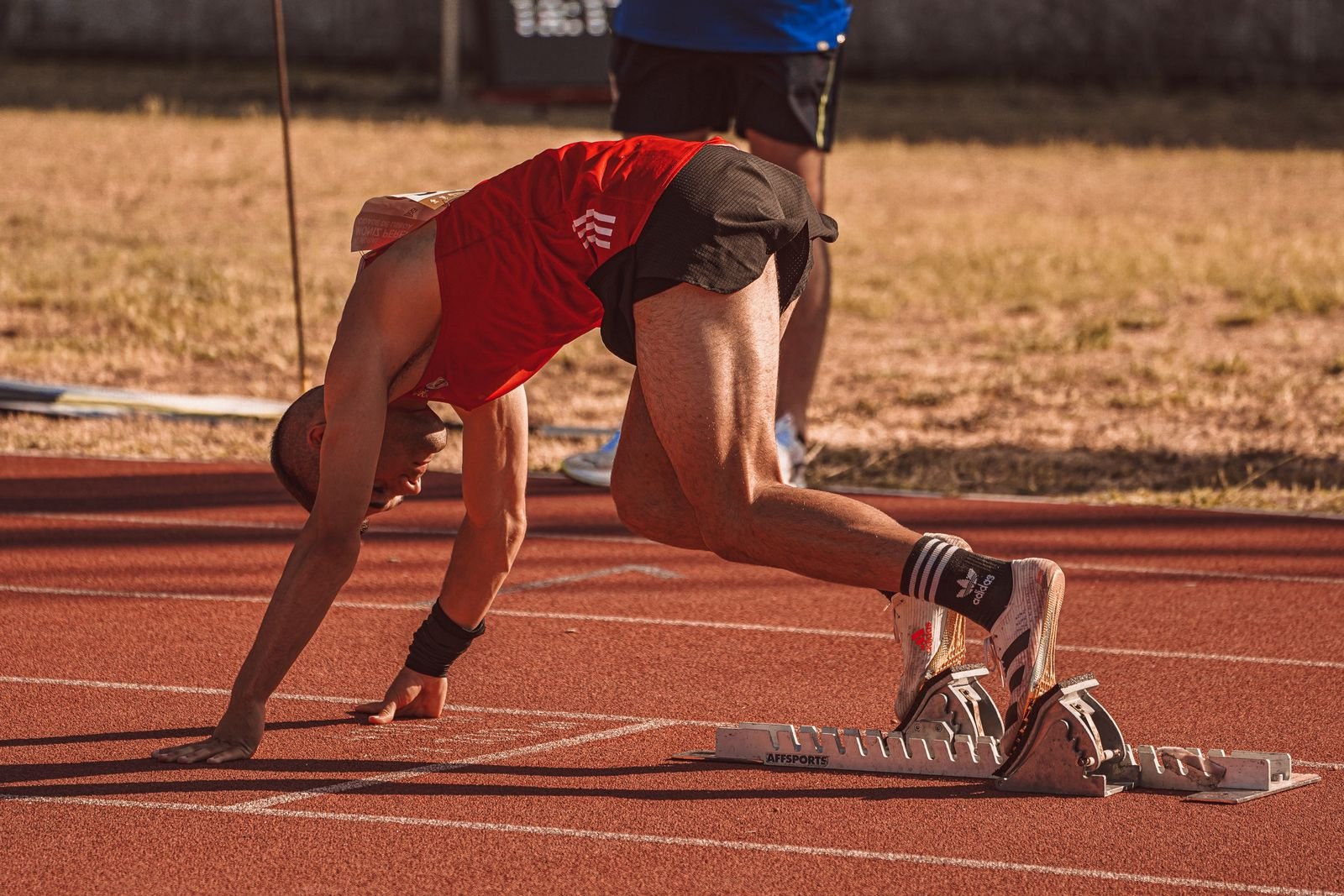 An athlete performing late-stage sprint training as part of a groin rehab exercises progression before returning to sport.