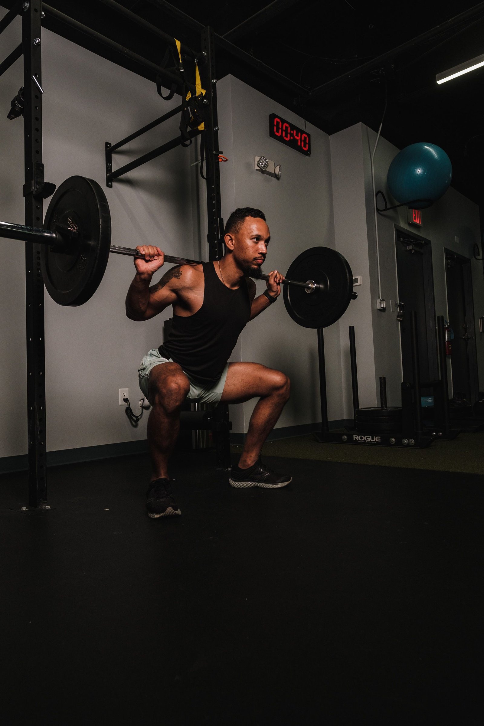 Athlete performing strength training relevant to physical therapy for sports hernia rehabilitation