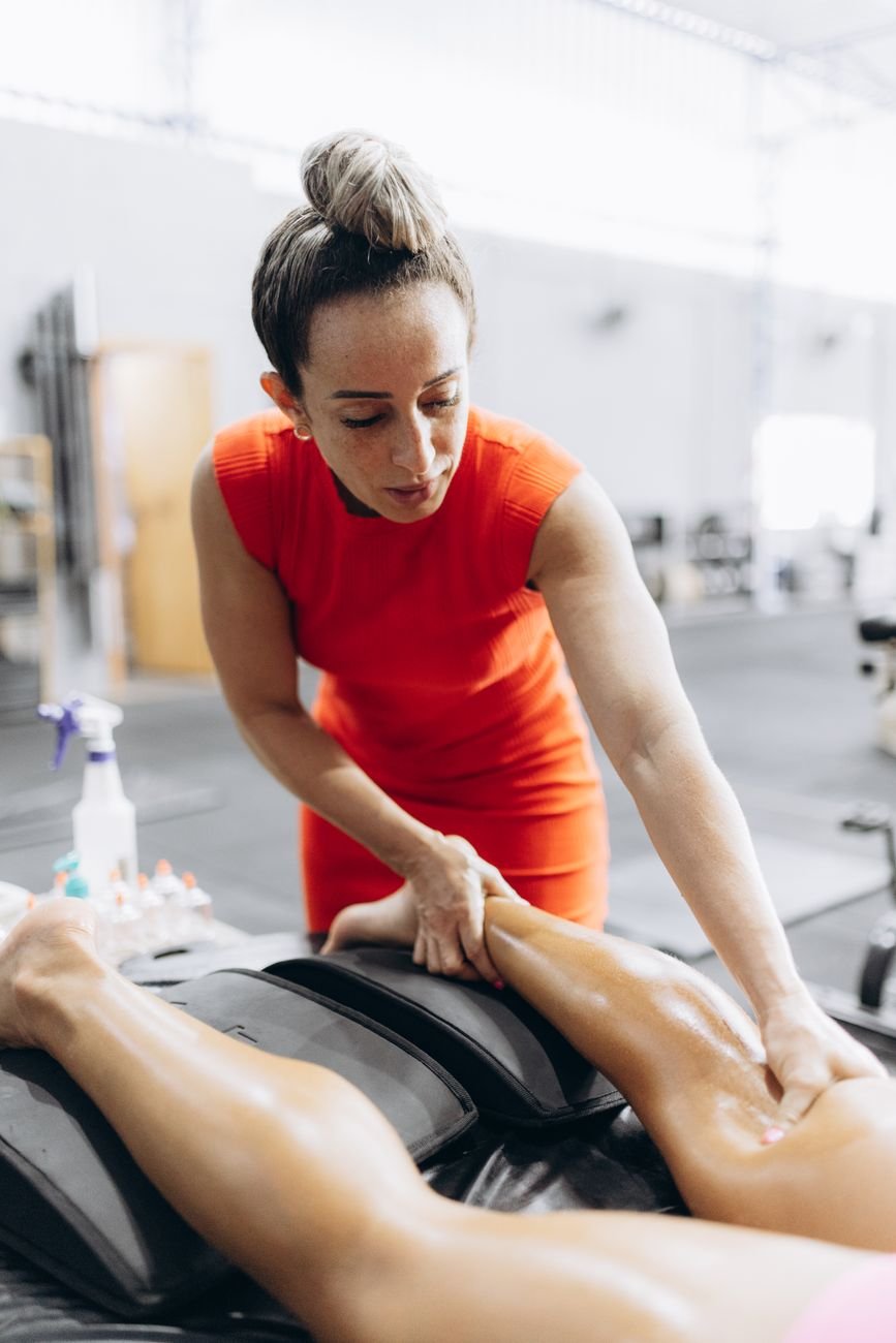 Runner receiving a sports massage session as part of marathon recovery tips