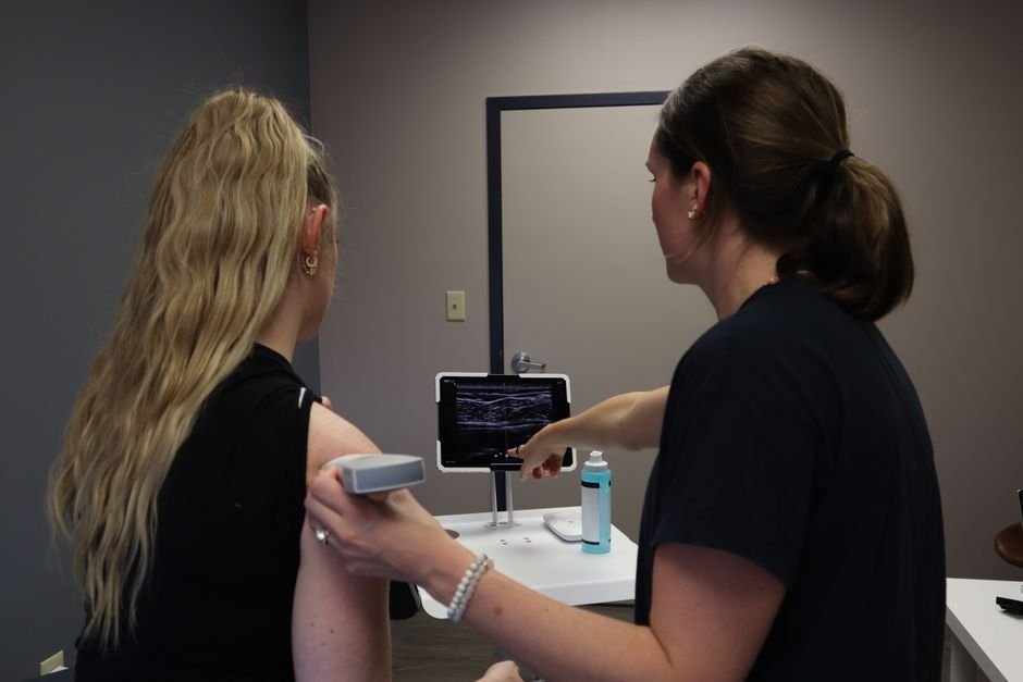 Clinician assessing shoulder stability as part of labrum tear shoulder recovery planning