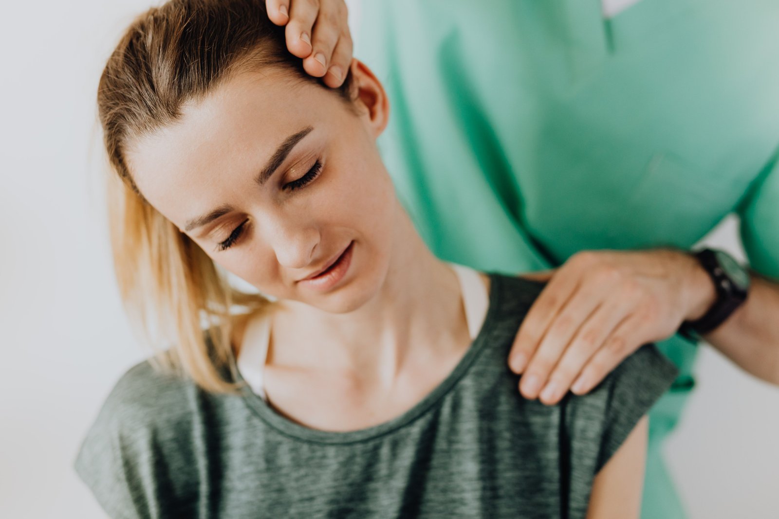 Therapist treating neck and shoulder tension when stretches for tech neck alone aren't enough