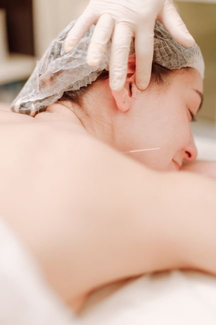 Person receiving reassurance before treatment while wondering is dry needling painful