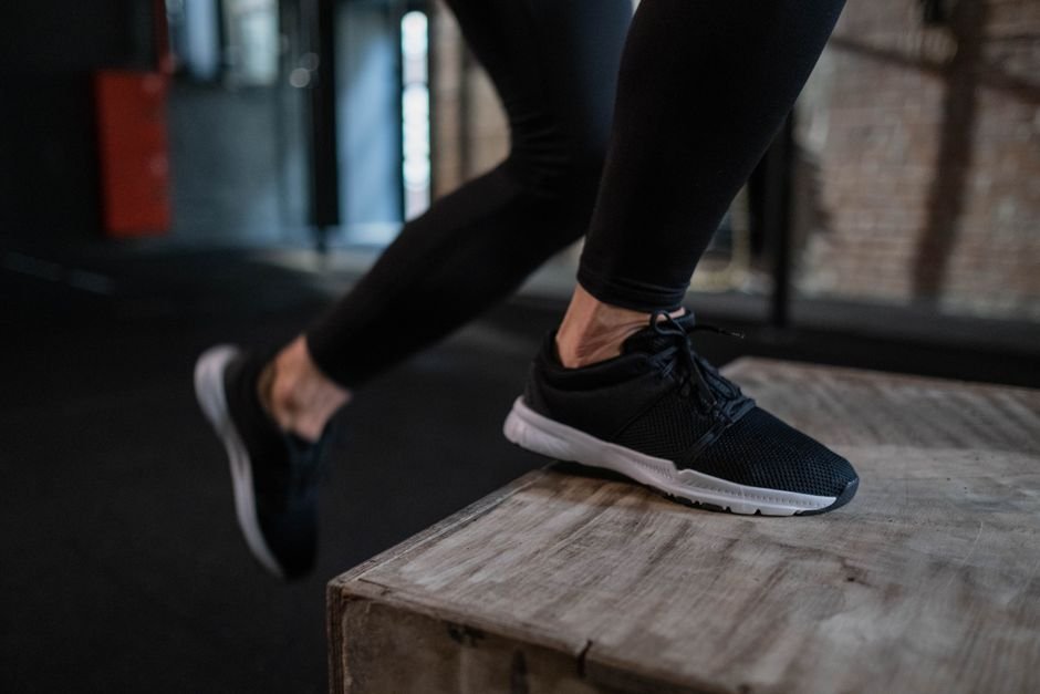 Athlete performing a late-stage achilles rehab exercise before returning to running